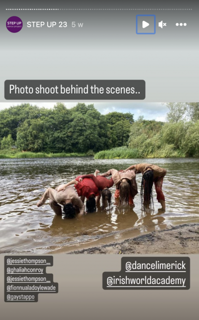 An instagram screenshot of five dancers in earth tone outfits standing in a river with their heads and hair dipping in the water.  